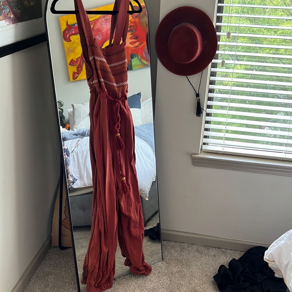 Never worn. Free People red jumpsuit